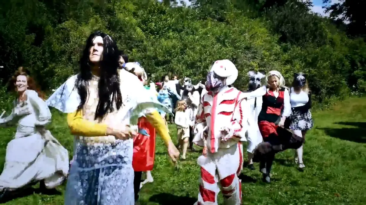 Costumed revellers celebrating at the fete near Stroud
